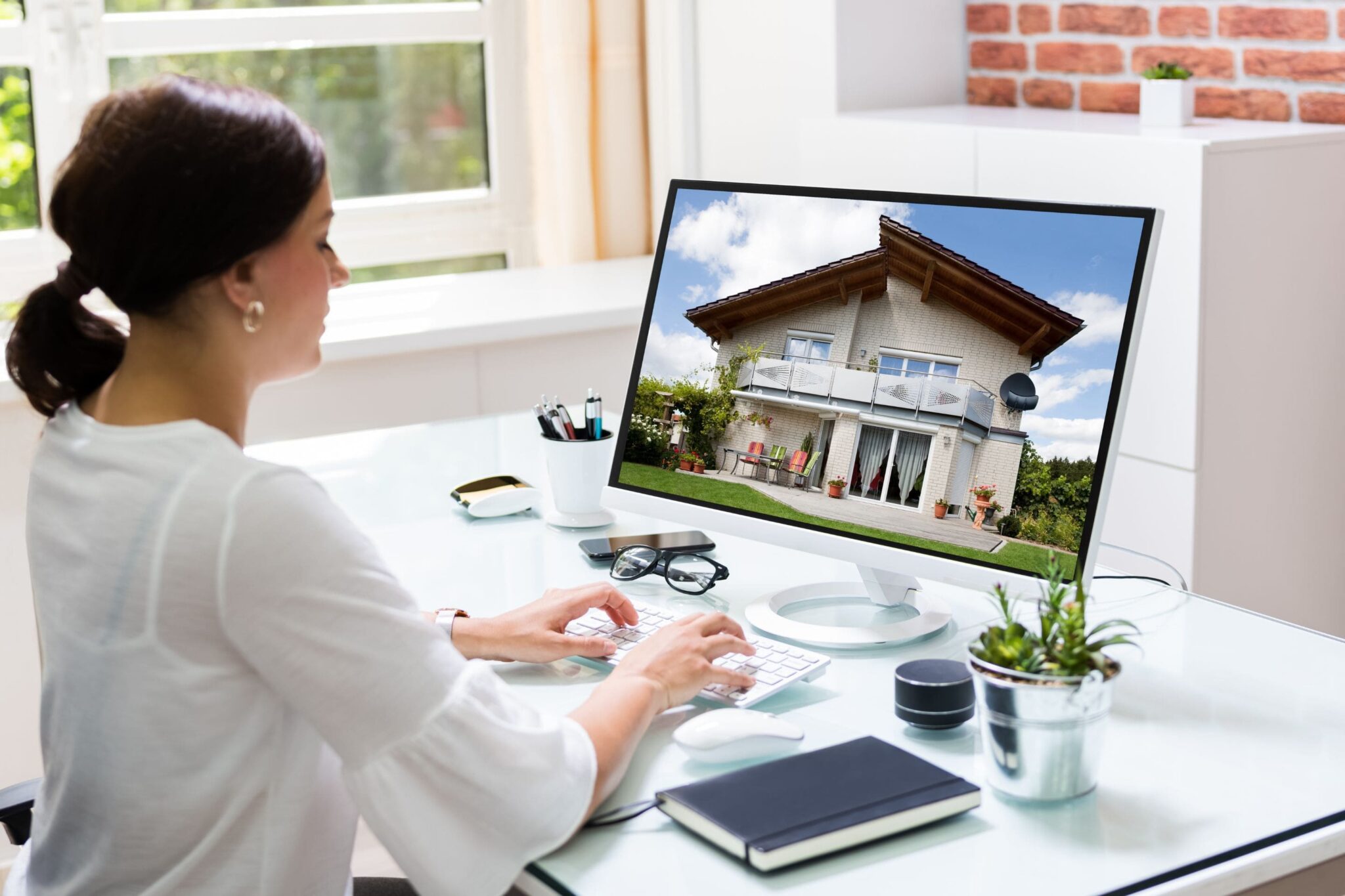 woman working on a vacation property listing online