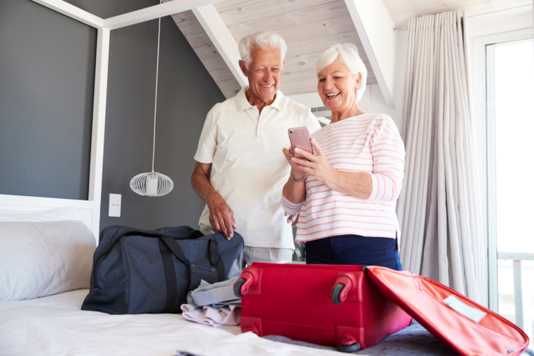 an older couple unpacking their bags in their vacation rental